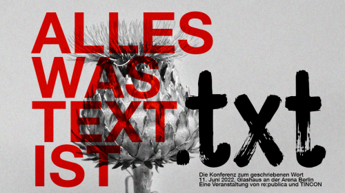 A black and white picture of a blossom ontop of which is written in capital red letters "alles was Text ist" ("everything that is text") as well as the .txt logo (pronounced: "text")