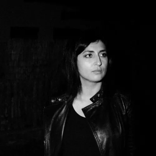 Black & white photograph of Zulaikha Ayub from mid-torso upwards