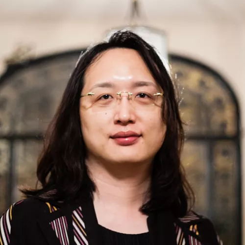 picture of audrey tang, she has long hair and glasses 