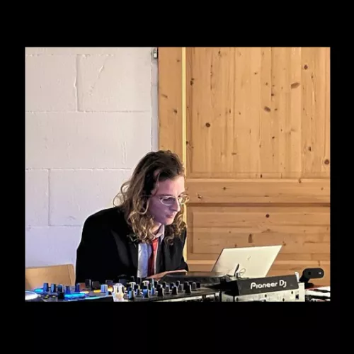 Martin Gius, programming on his laptop