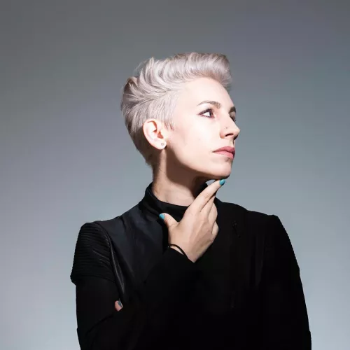 Color photograph of Daniela Gandorfer against a grey background. 
