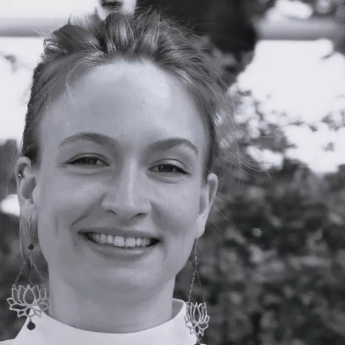 Black and white photo of a person smiling