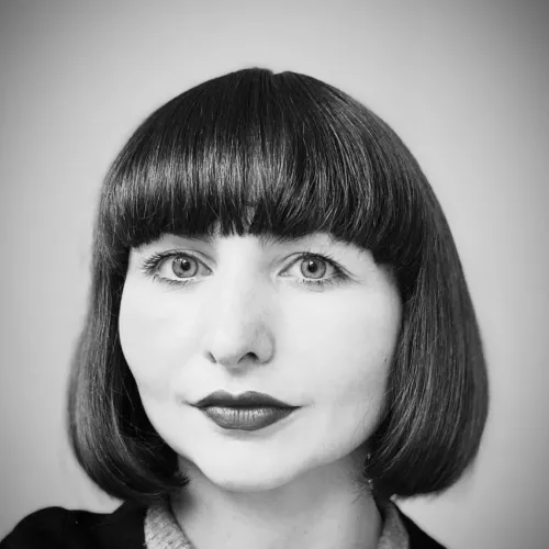 Black and white picture of a woman with a short haircut.
