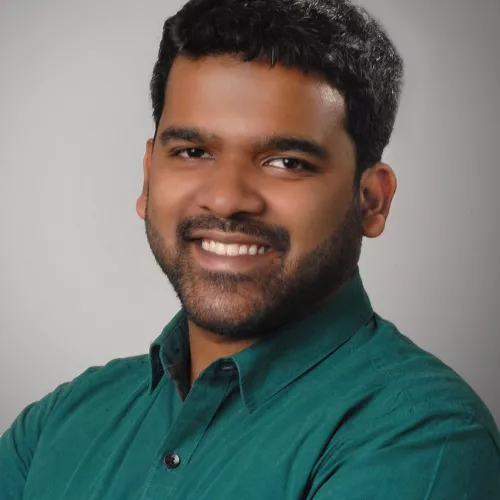 Potrait photo of Udbhav Tiwari in a green shirt