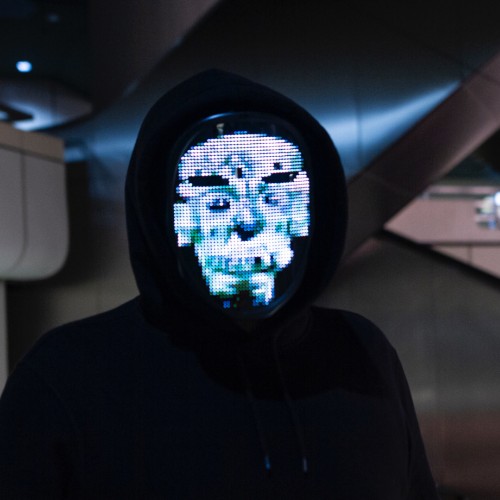 Picture of a man wearing a black hoodie and a LCD mask.